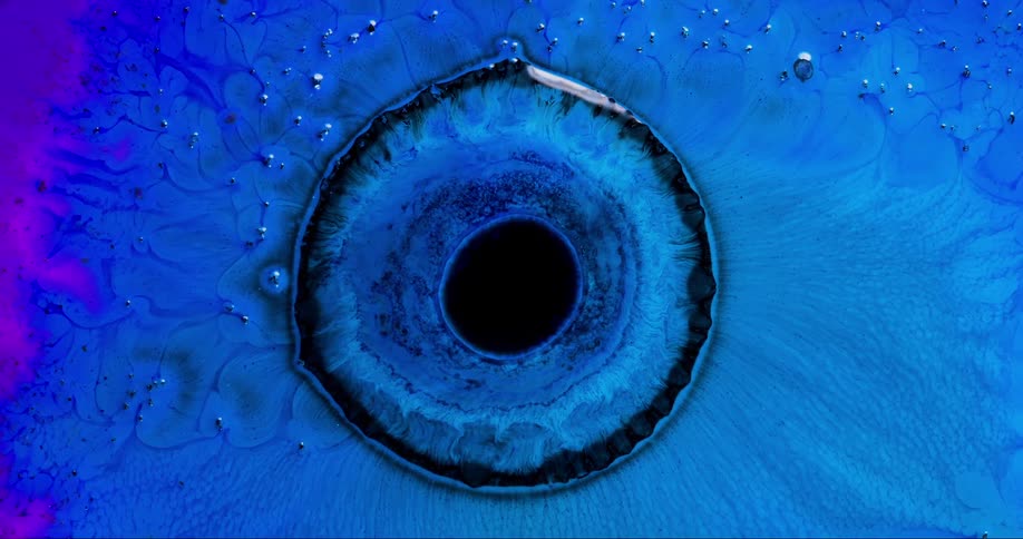 A blue paintlike liquid flows towards a central circular location