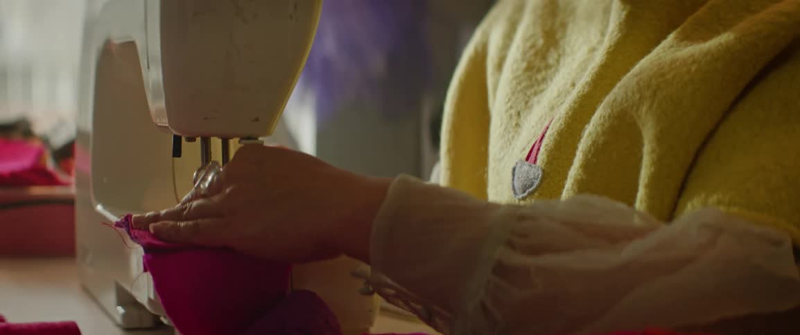 Seamstress working with sewing machine