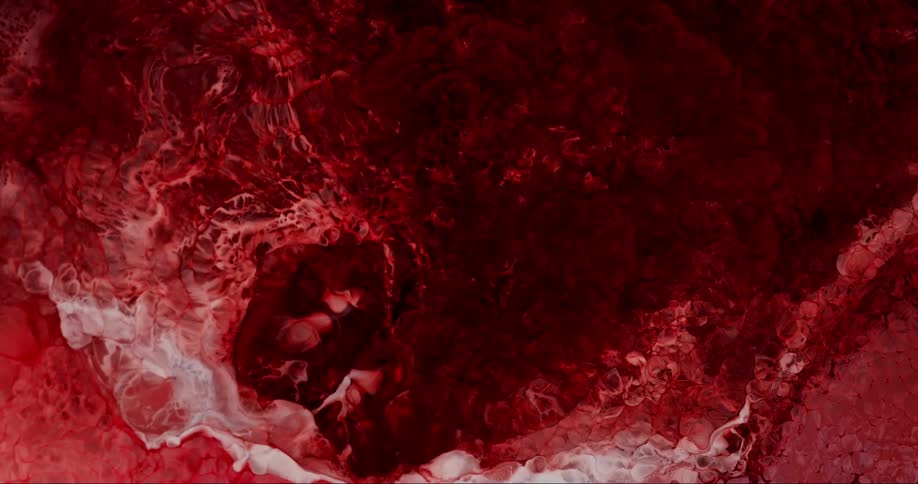 Abstract red liquid churns