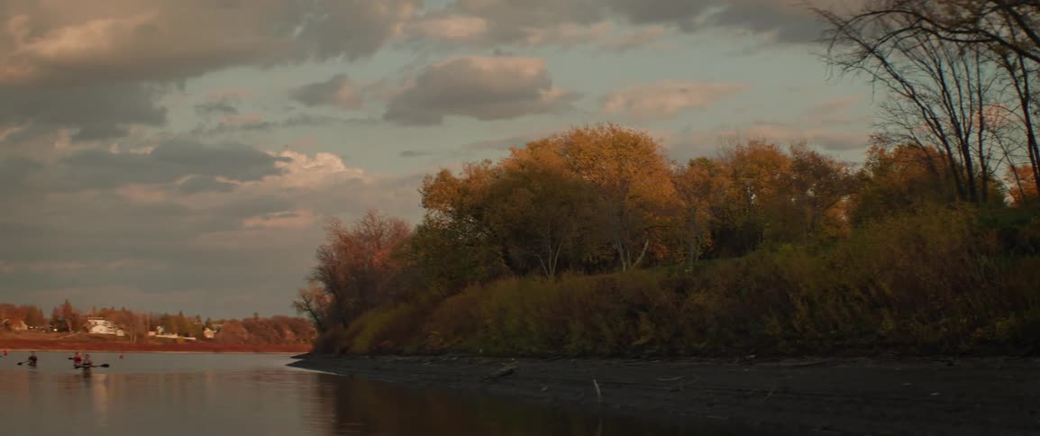 View of a river with multiple people kayaking