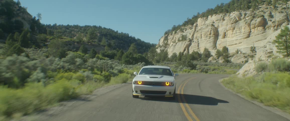A car speeding down a remote road