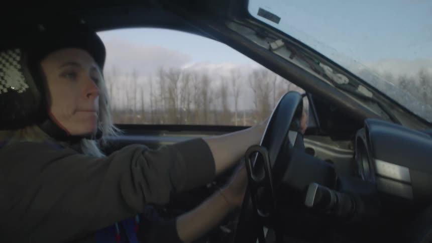 A woman driving a car in a rally