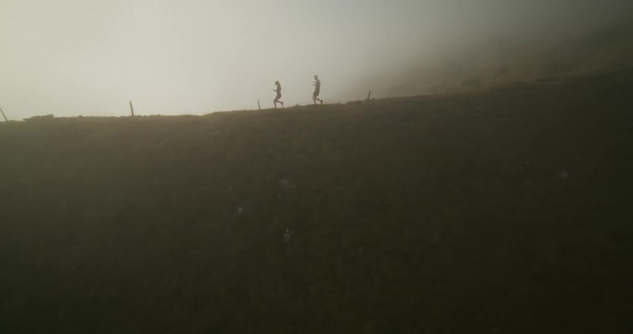 Two people are running down the mountain