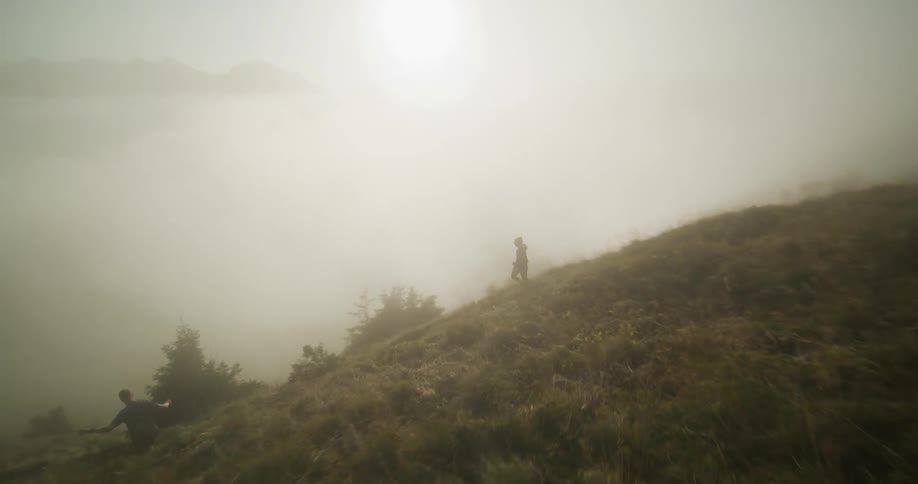 Two people run down the mountain