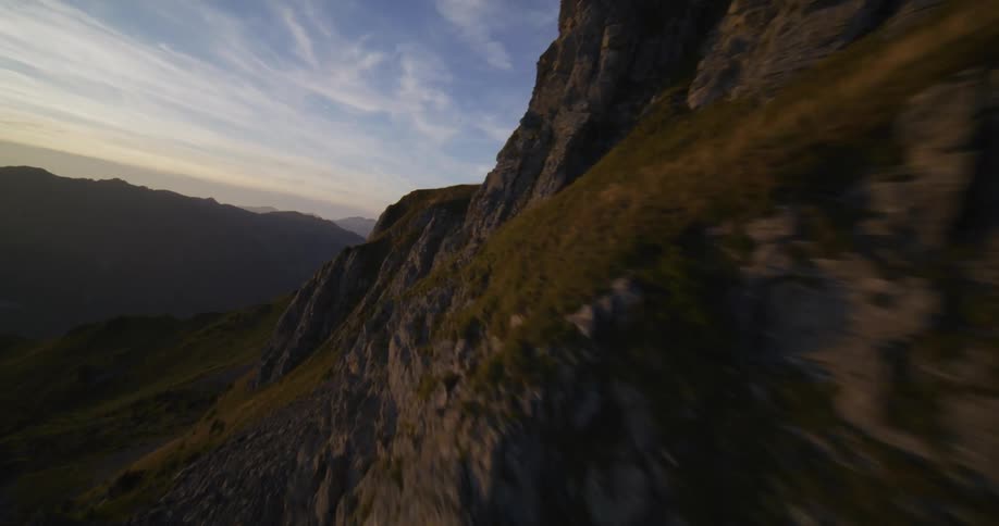 The top of the mountain covered in rocks and short grass