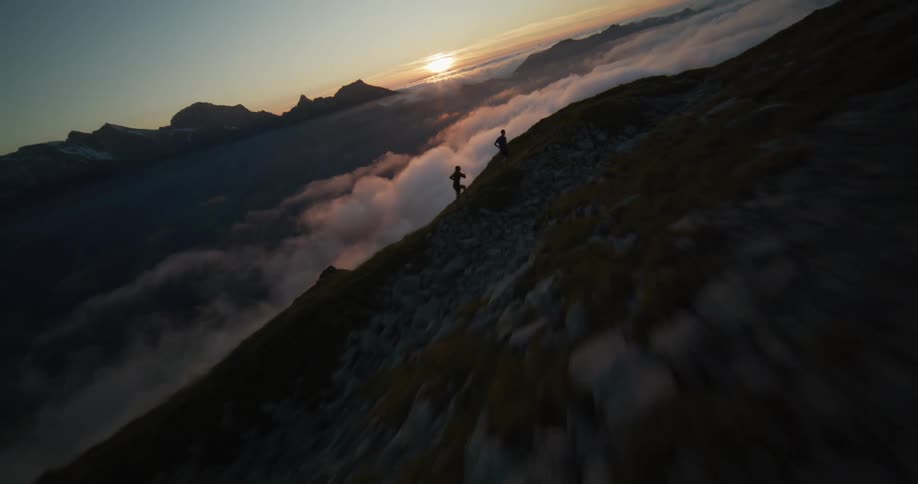 Two people are running up the mountain