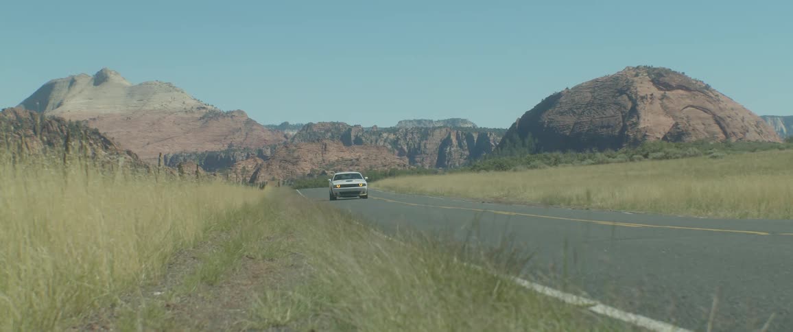 A car races down the highway