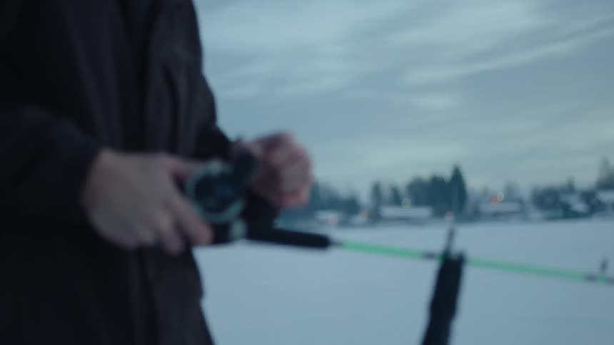 Person fishing in very cold weather