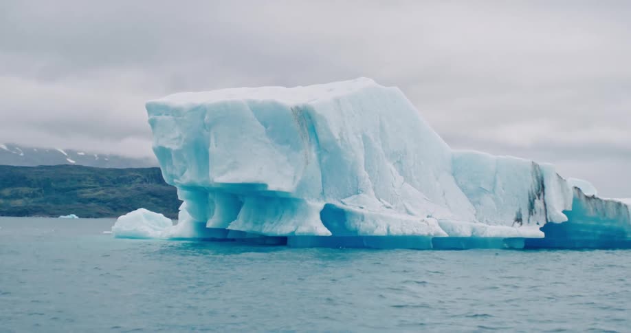 A large iceberg floating in the arctic ocean