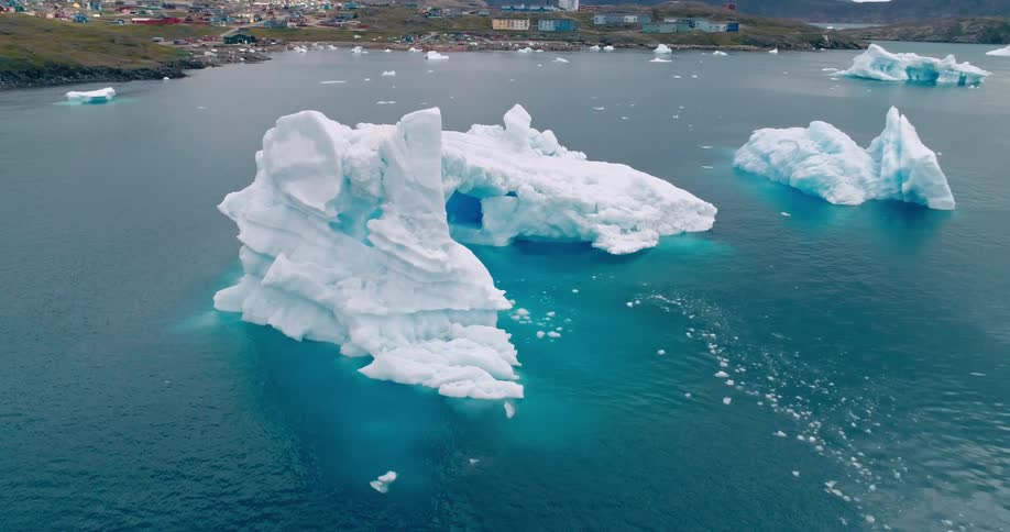 Large icebergs sit in the water