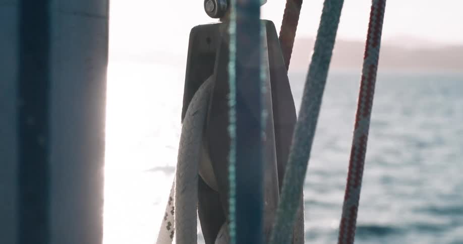 Close up of a pulley in a sailboat on the ocean