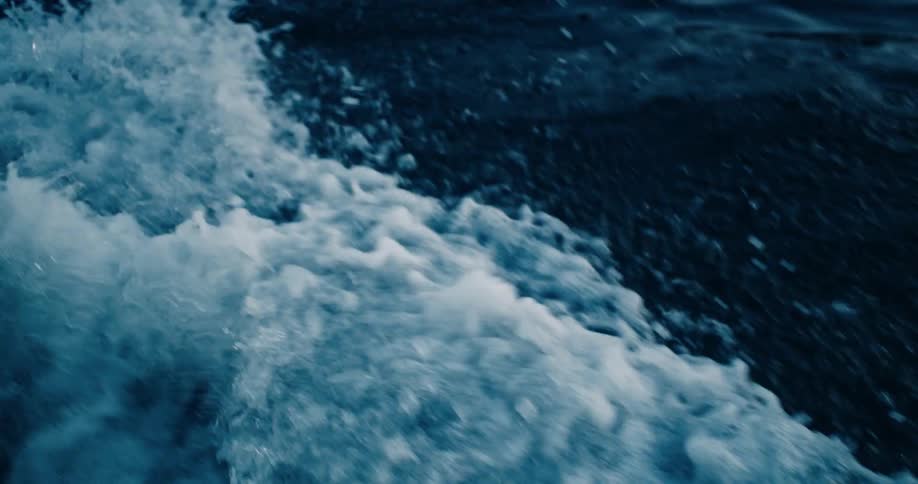 Closeup of sea waters moving under the pressure of a boat