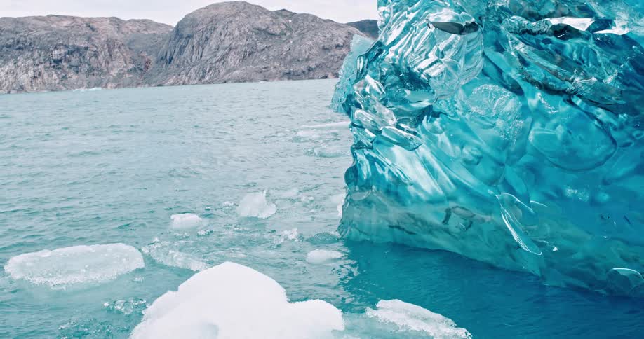 View of the sea with icebergs in slow motion