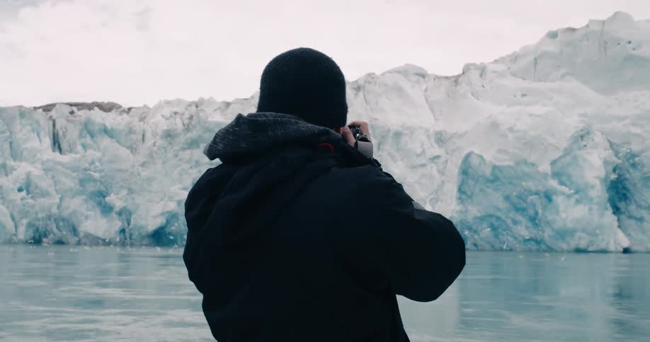 A man is photographing the ice caps