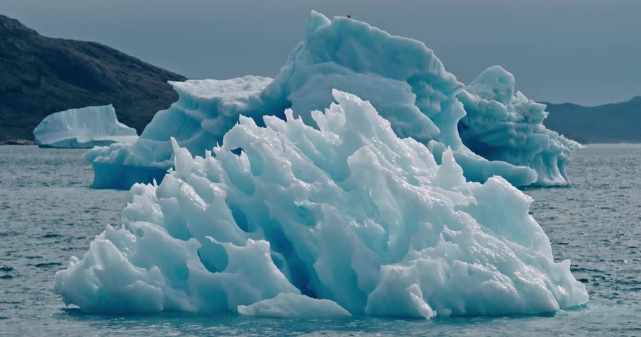 View of small icebergs in the midst of the sea
