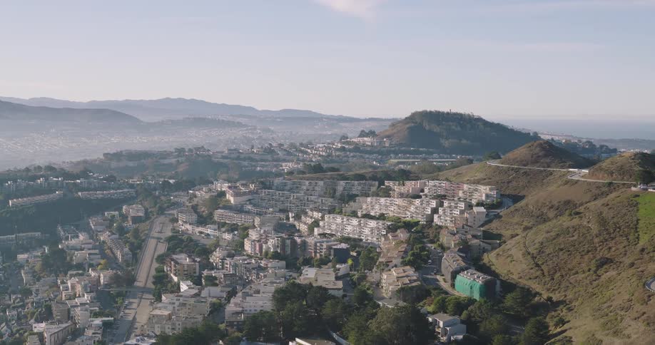 Apartment buildings built into the side of low mountains