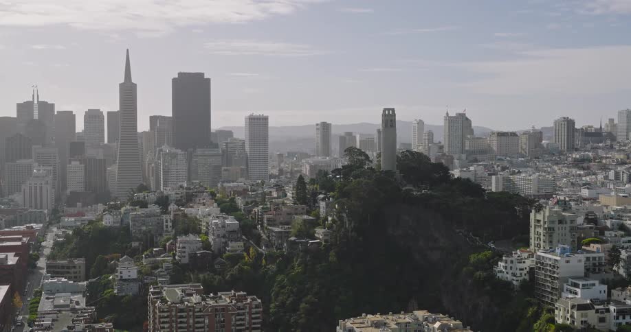 Aerial view of a grayishlooking city with lots of buildings