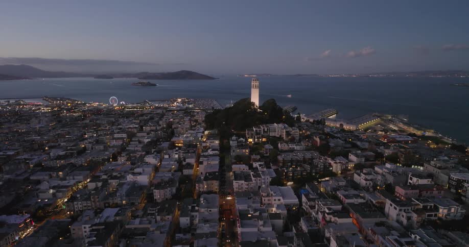 Skyline of a coastal city during dusk