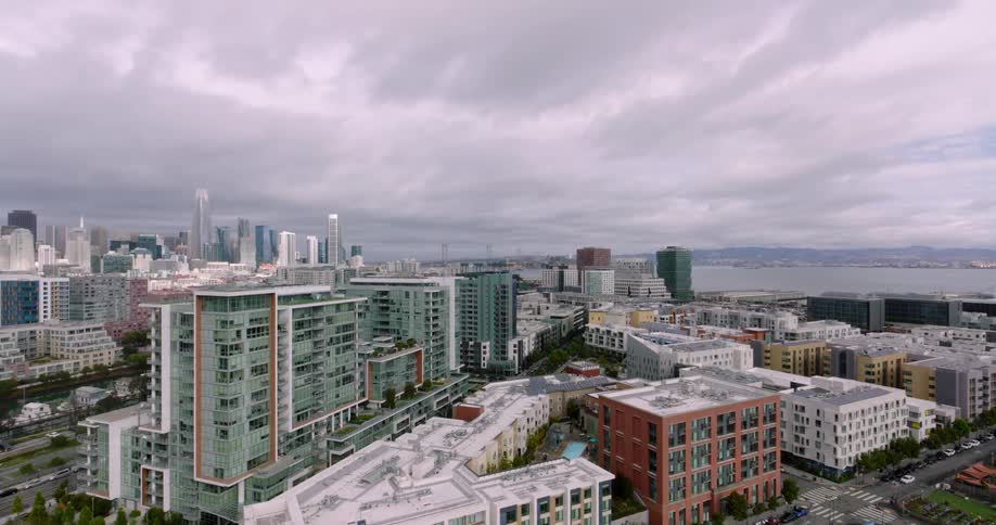 A soccer field is before the city