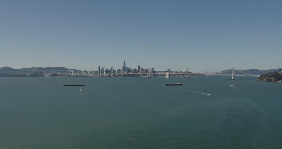 Aerial view of ships moving near the skyline of san francisco