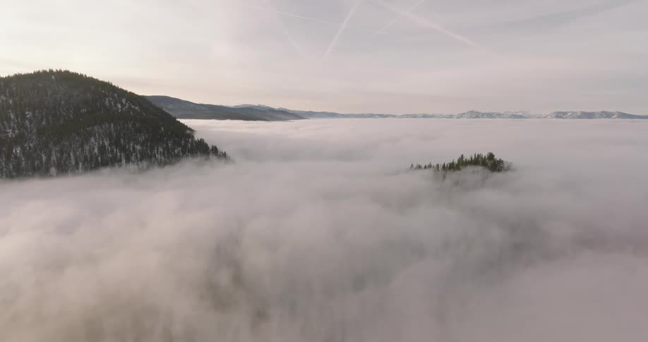 Aerial view of low clouds over the mountains