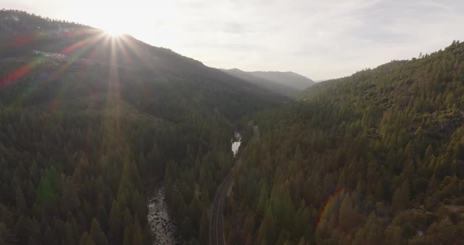 A road crossing a forest valley