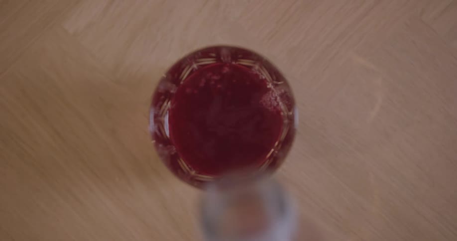 Serving a glass of red juice