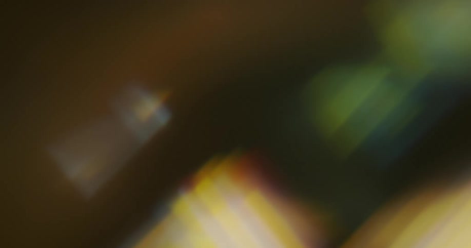 Close up of geometric shapes spinning reflecting light