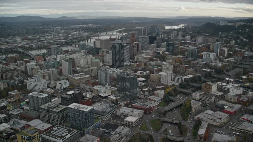 Aerial view of houses along the riverfront in the city where rooftops meet the flowing water in urban harmony