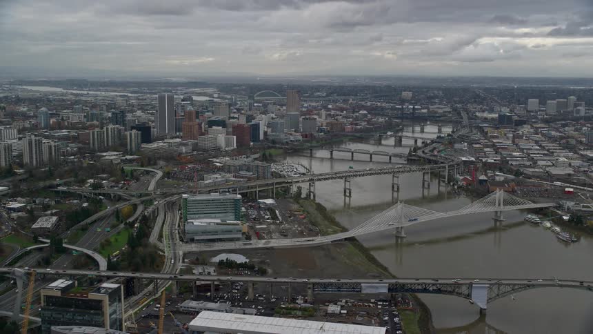 Aerial view of bridges over a river on a waterfront city