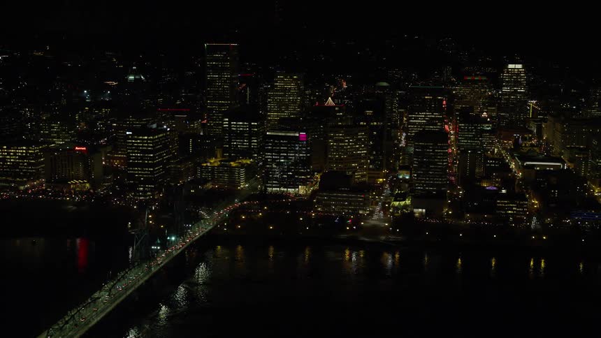 Aerial view of night lights in a waterfront city