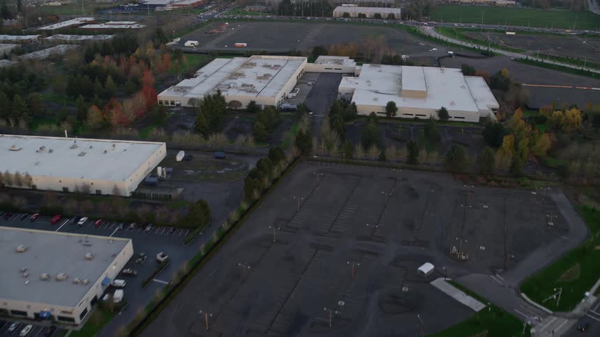 Aerial panorama of a city with factories parking lots and establishments