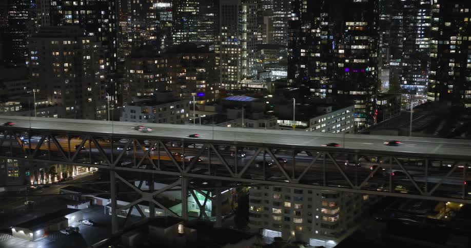 Vehicles drive over the bridge in the city