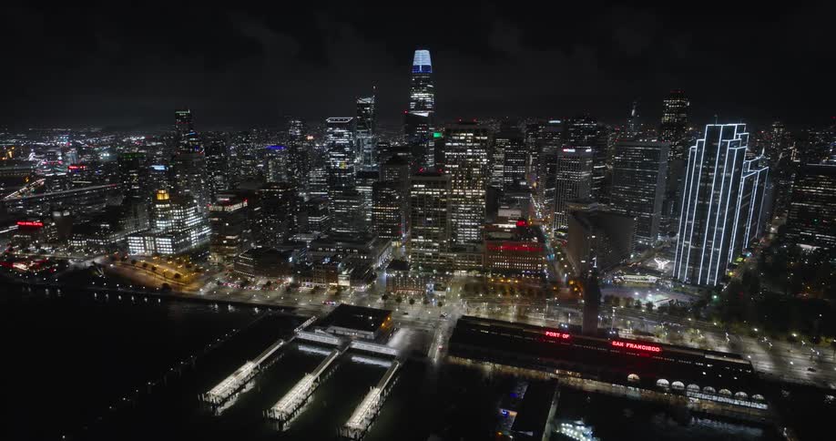 The buildings are brightly lit at night
