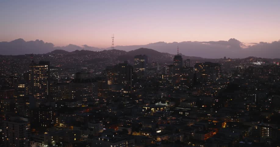 Aerial view of an illuminated metropolitan skyline