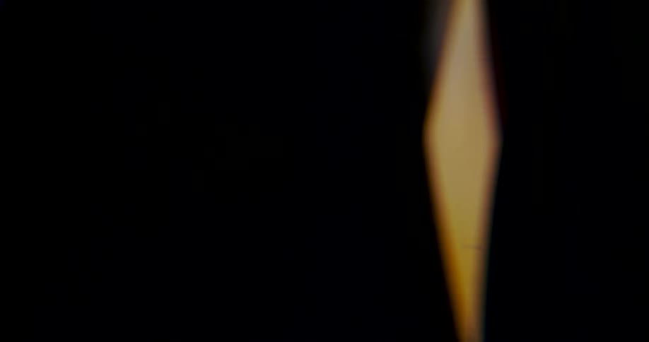 The fire is flickering in the dark