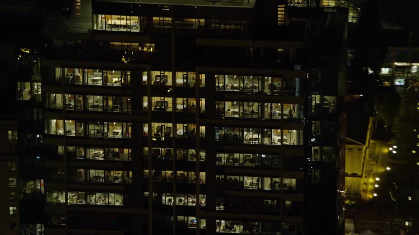 Aerial view of skyscrapers in the city at night