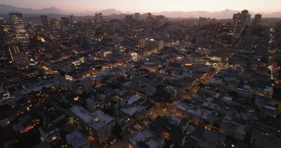 The city is brightly lit at sunset