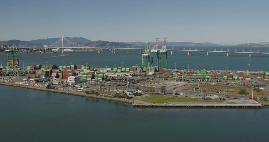 Aerial view of shipping containers in a yard next to port