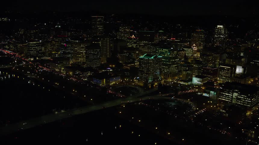 Skyline of a metropolitan city with illuminated buildings at night