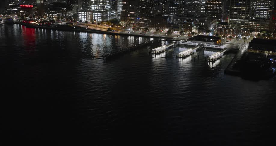 Aerial view of the skyline of a waterfront city at night