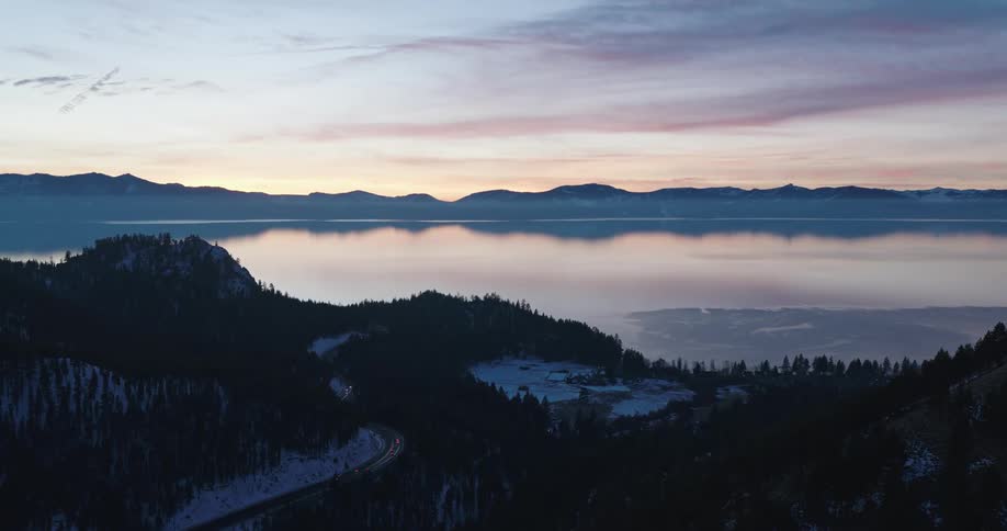 Aerial view of a lake in the mountains at sunset