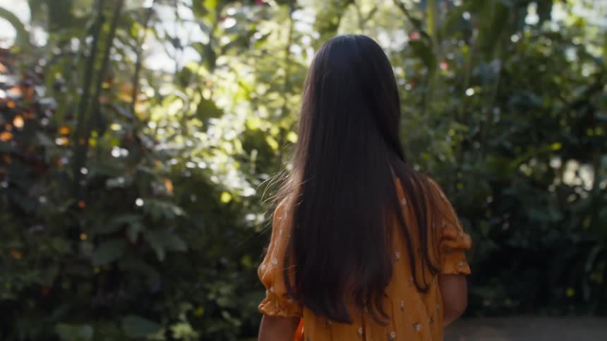 A child walks around the garden