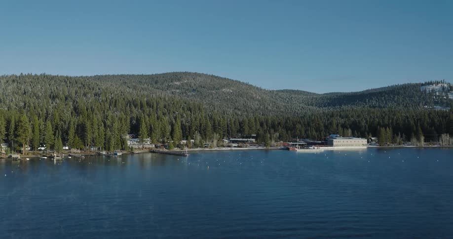Aerial view of a pier on a lake in the mountains