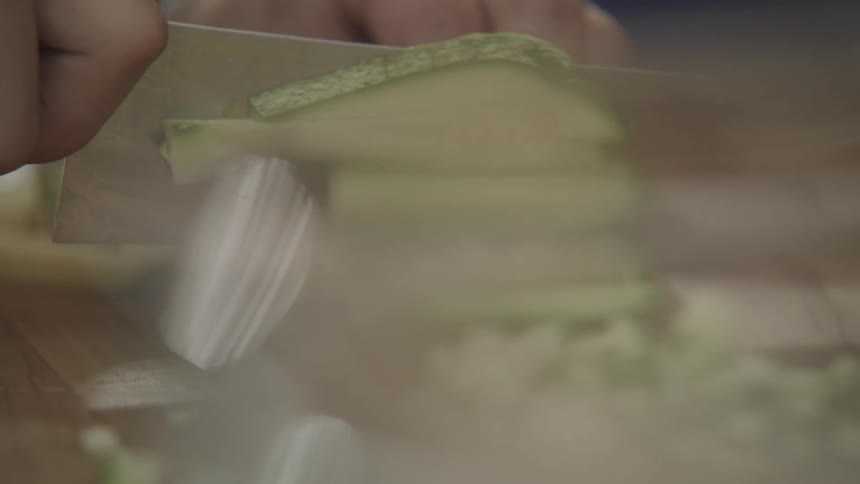 Person cutting vegetables on a cutting board