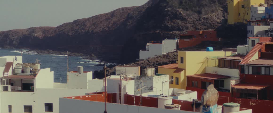 A small coastal town with colorful buildings