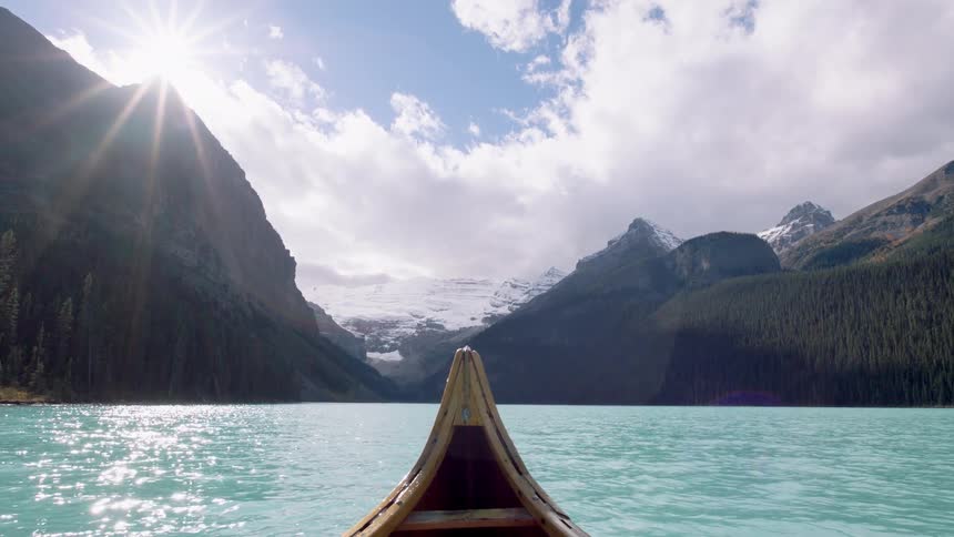 Canoe floating on a lake in the mountains