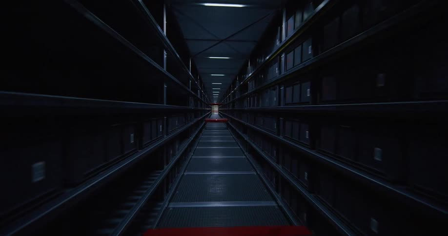 fpv drone flying through the aisles on a warehouse
