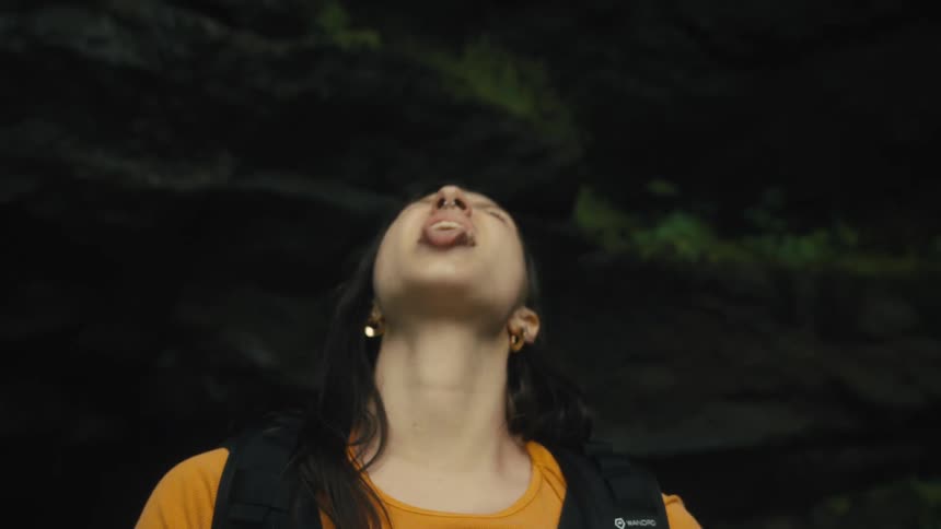 A woman is exploring a cave