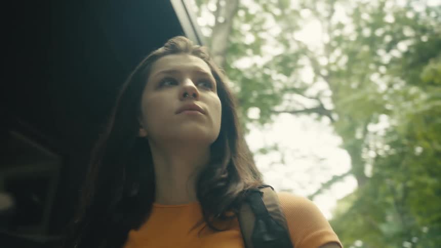 Woman walking in nature with a selfie view